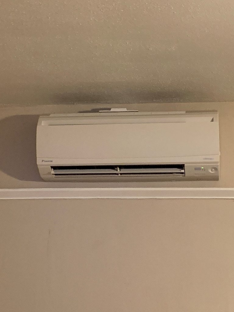 ductless heat pump inside by ceiling