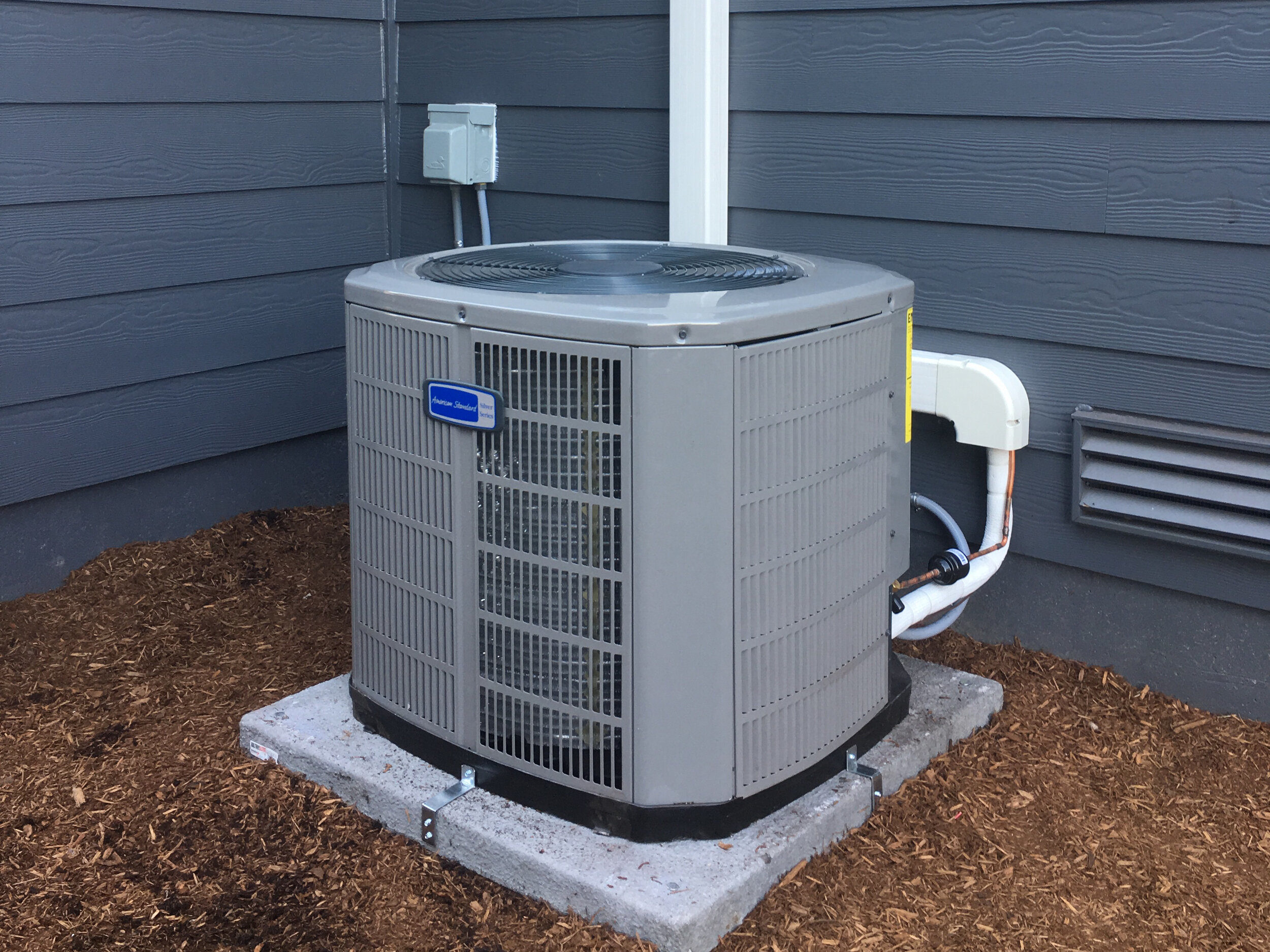air conditioner outside gray house 2